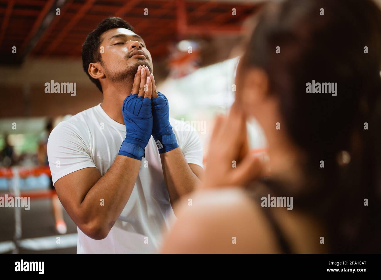 female boxer and the male boxer standing stretching Stock Photo