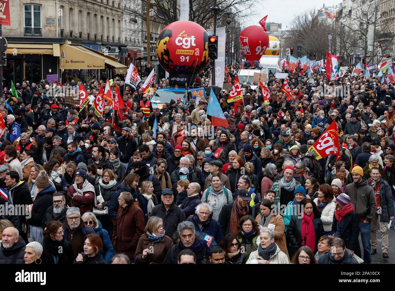 General Confederation of Labour (CGT) trade union logos are seen as demonstrators march against the government's pension reform plan in Paris, France, March 11, 2023. REUTERS/Benoit Tessier Stock Photo