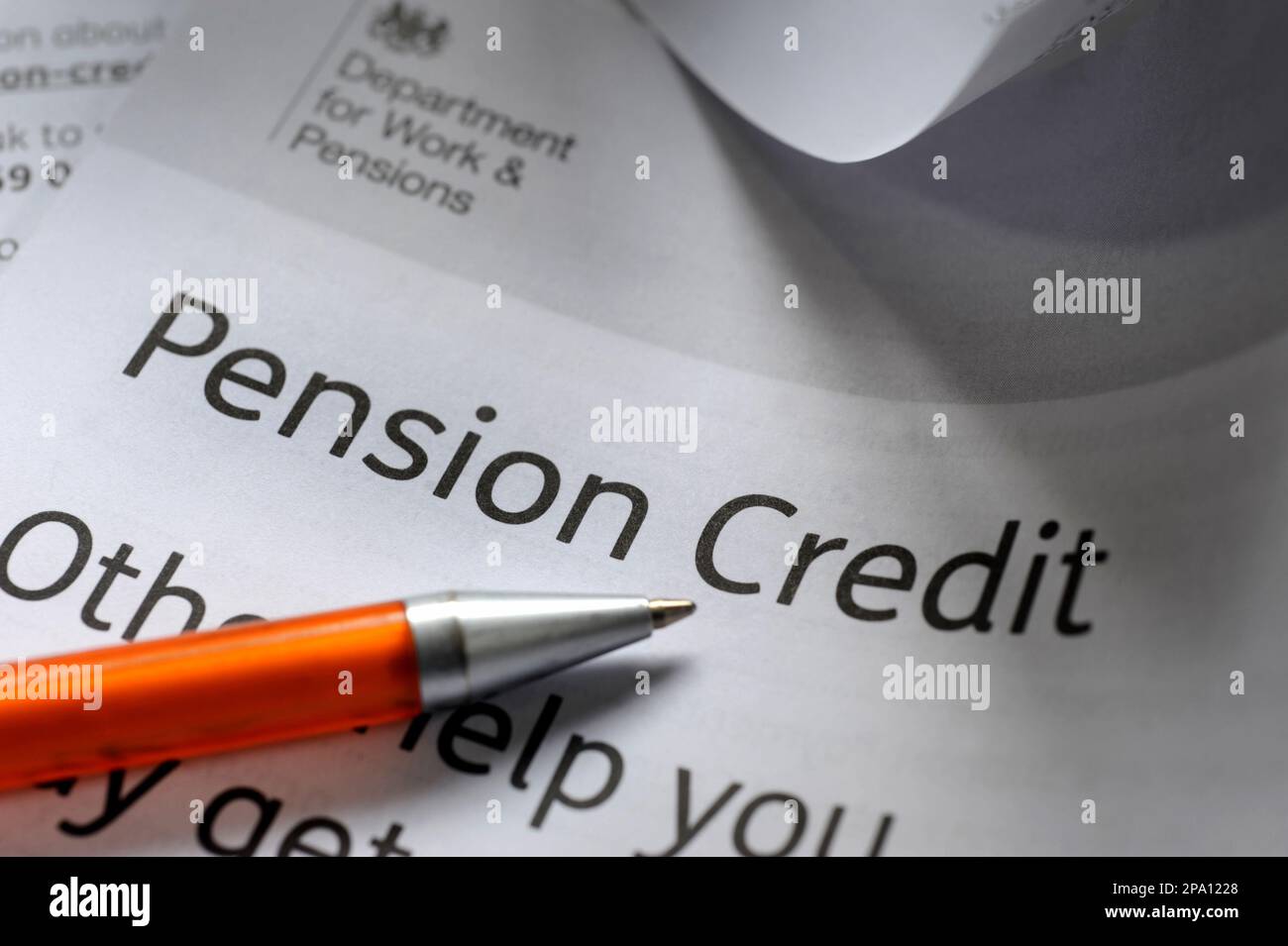 GOVERNMENT PENSION CREDIT INFORMATION LEAFLET AND PEN RE STATE PENSIONS BENEFITS INCOMES PENSIONERS ETC UK Stock Photo