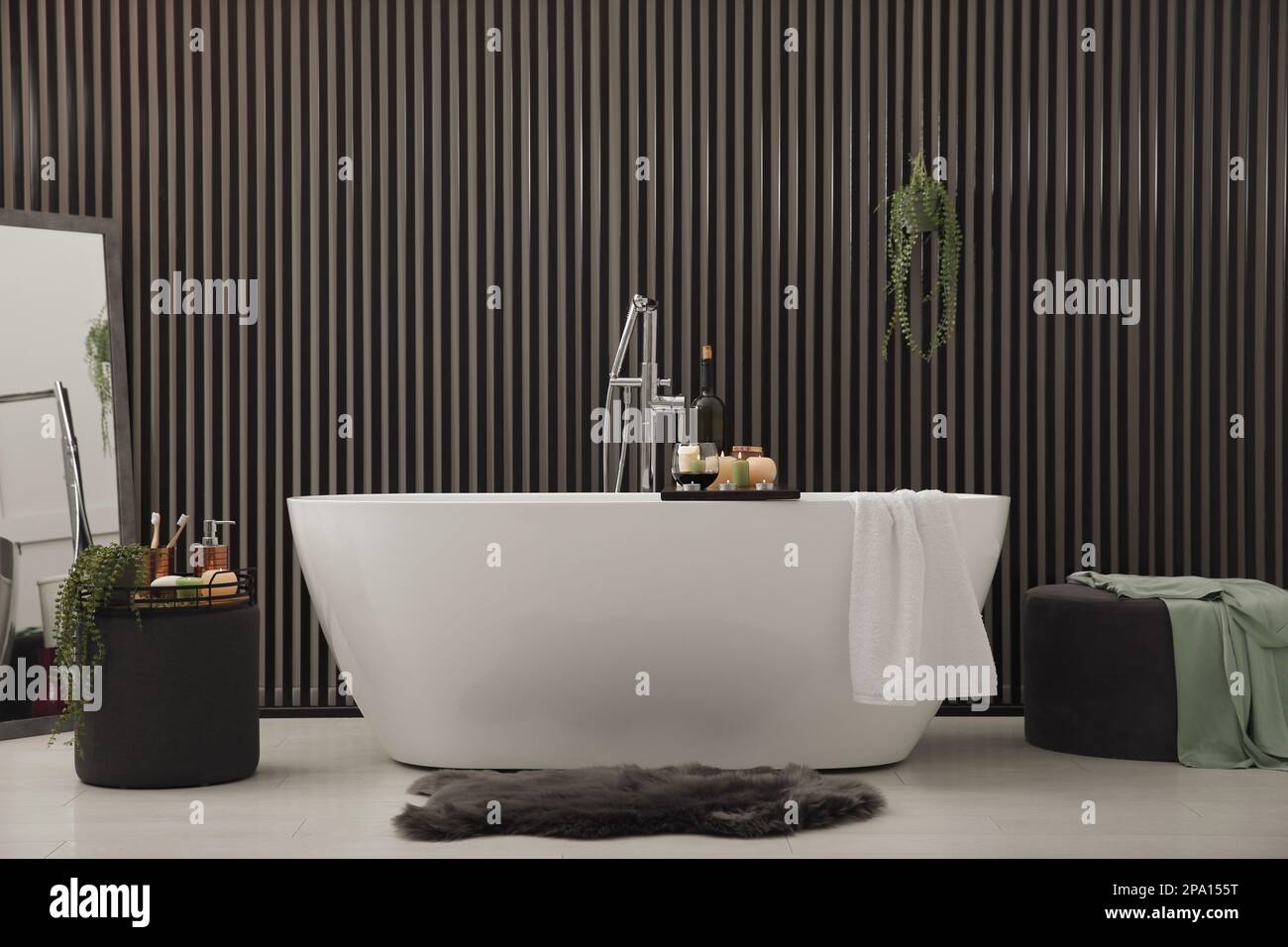Stylish bathroom interior with modern white tub Stock Photo - Alamy