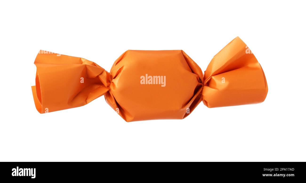 Delicious candy in orange wrapper isolated on white Stock Photo Alamy