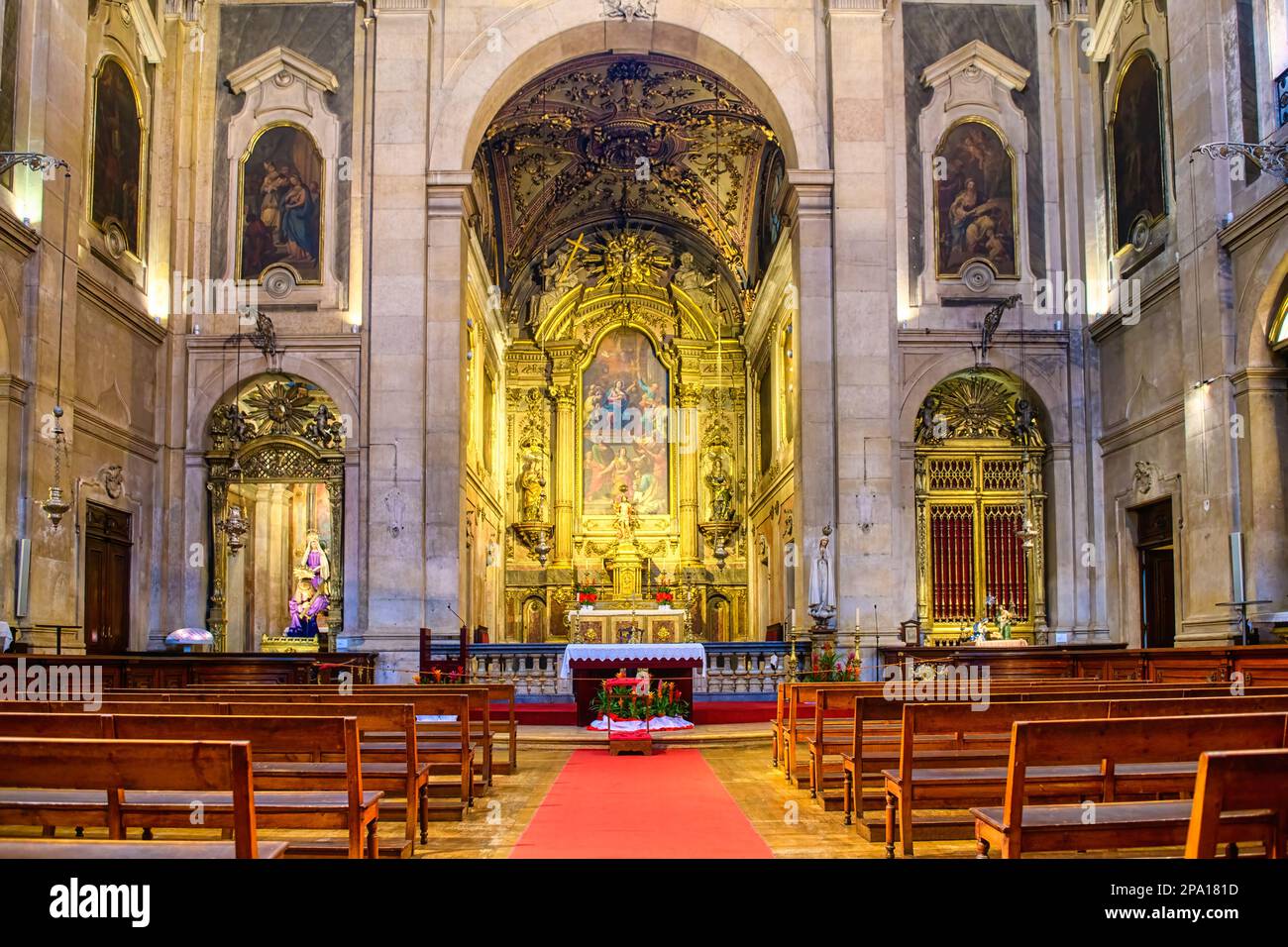 Symmetric view of the altar and benches alongside a red carpet.Church ...