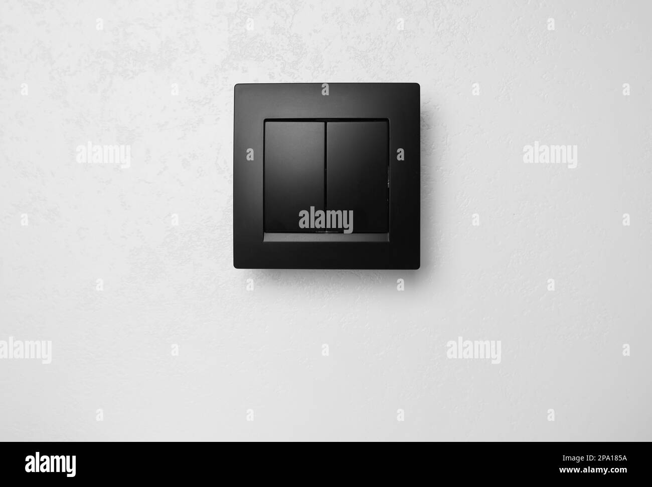 Black plastic light switch on white background Stock Photo Alamy