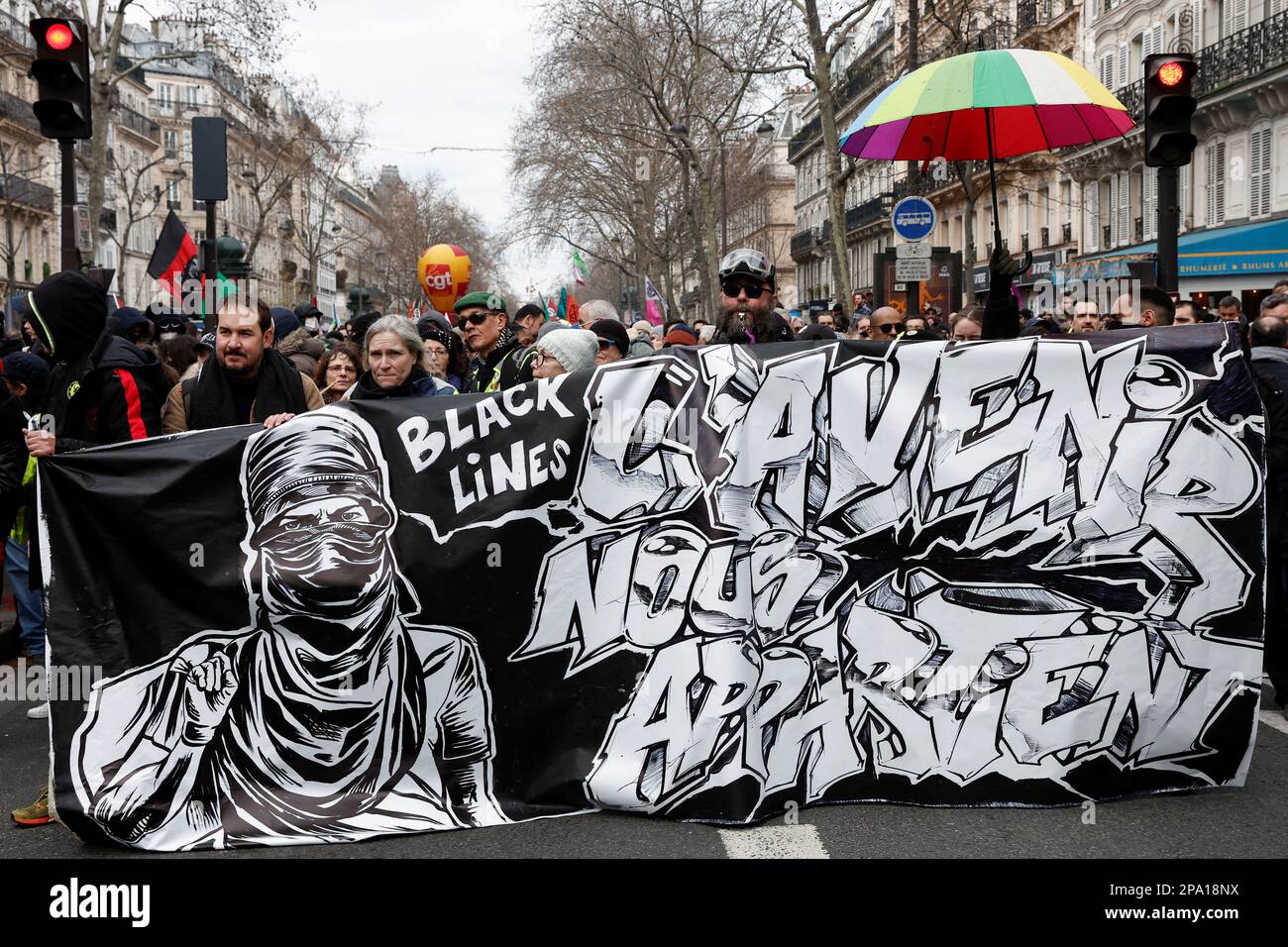Demonstrators hold a banner during a march against the government's pension reform plan in Paris, France, March 11, 2023. REUTERS/Benoit Tessier Stock Photo