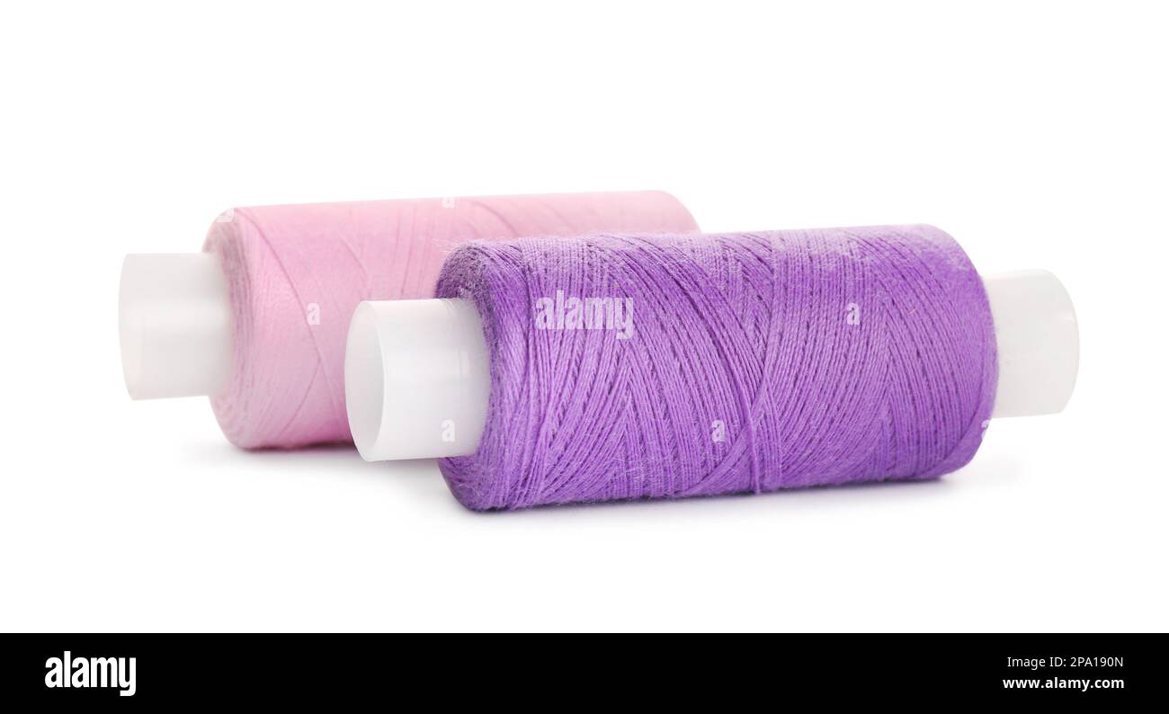 Different colorful sewing threads on white background Stock Photo - Alamy