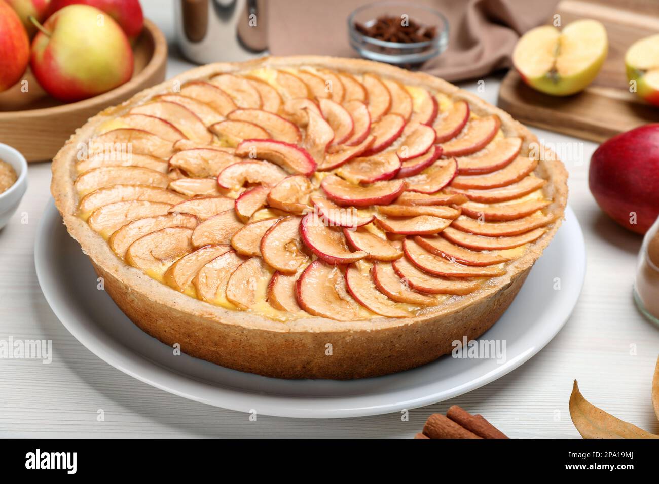 Tasty apple pie on white wooden table, closeup Stock Photo