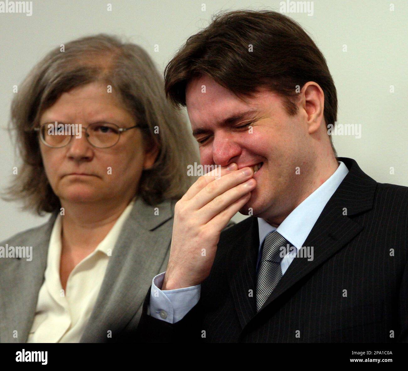 Defendant Neil Entwistle cries with his attorney with his attorney Defendant Neil Entwistle cries with his attorney with his attorney