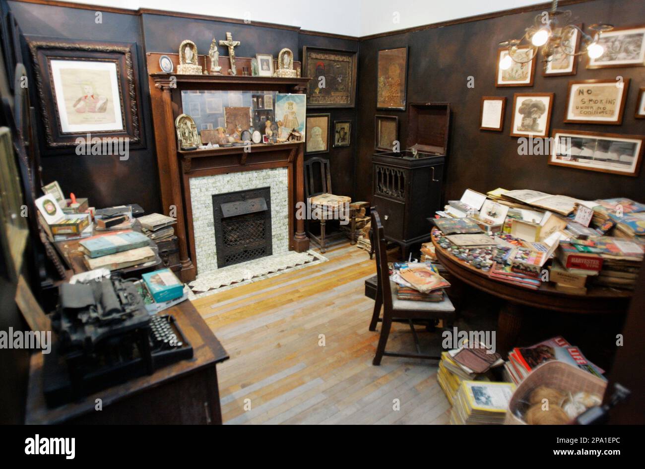 An exhibit showing a small and incredibly cluttered room belonging 