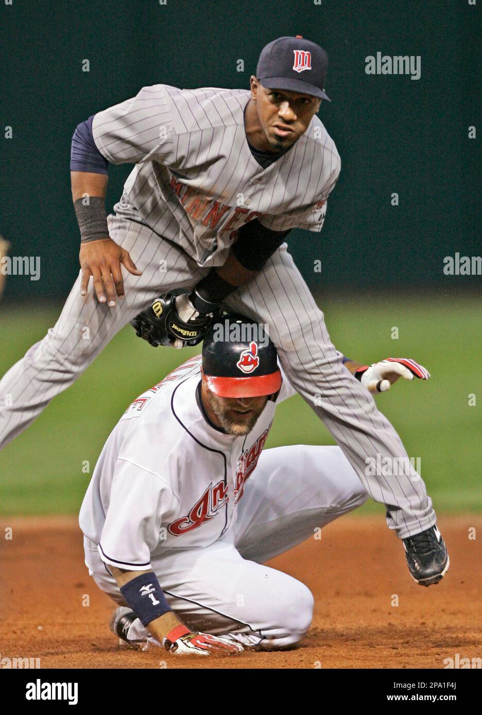 Minnesota Twins second baseman Alexi Casilla lands on Cleveland Indians