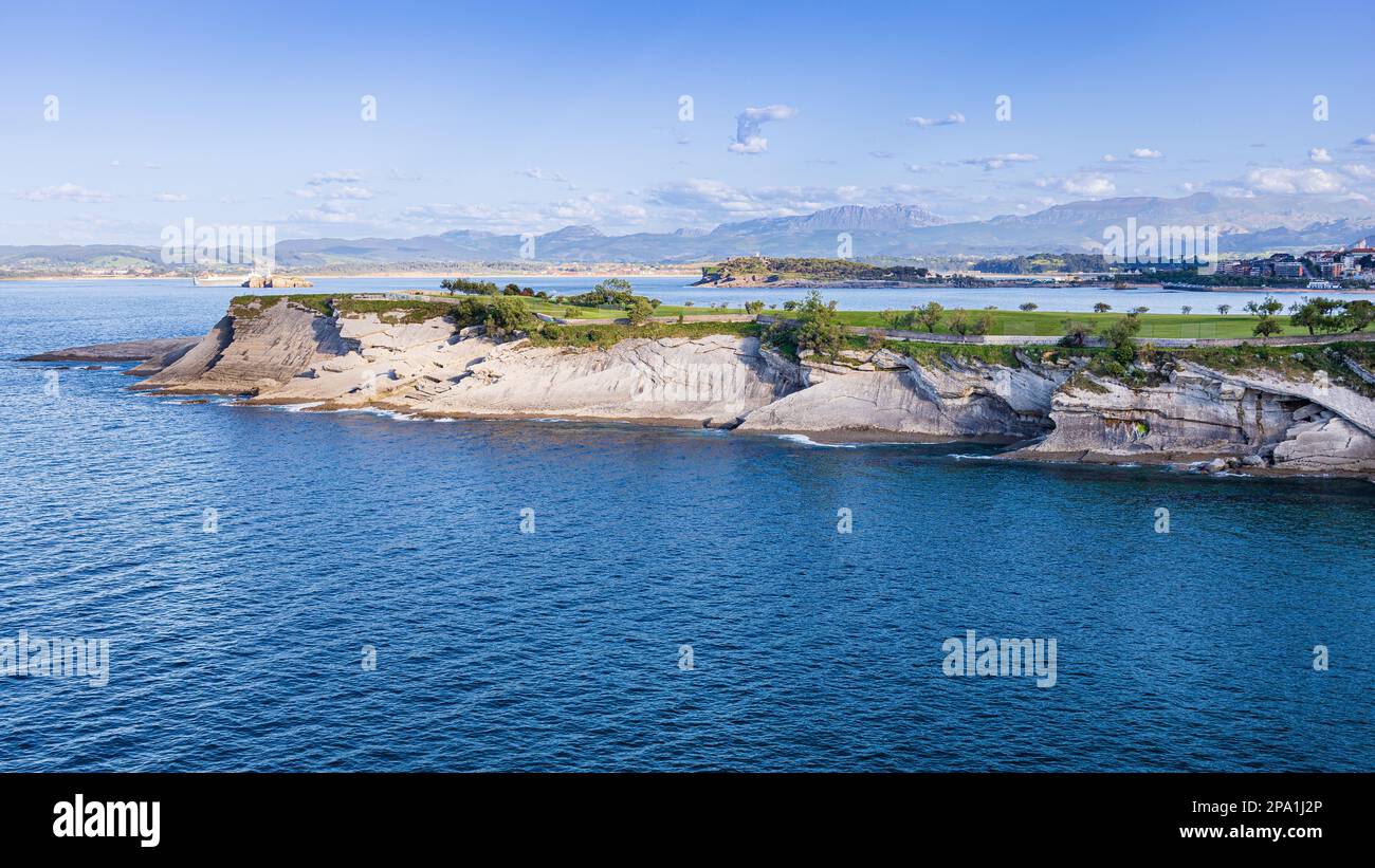 Cabo Menor, land projection towards the Cantabrian Sea, Santander Bay, city and mountains in the background. Santander, Cantabria, Spain. Stock Photo
