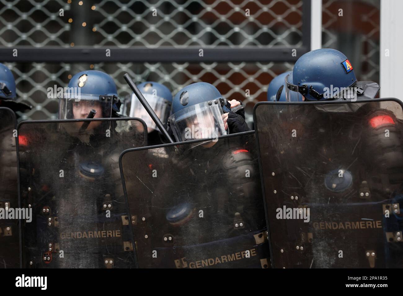 Riot police hold their shields as demonstrators march against the government's pension reform plan in Paris, France, March 11, 2023. REUTERS/Benoit Tessier Stock Photo