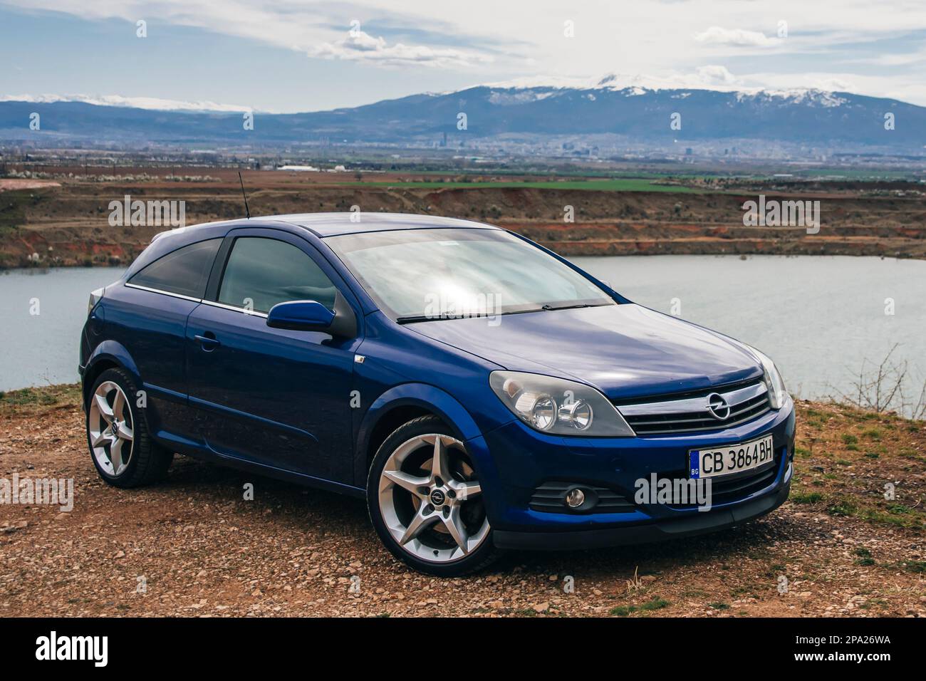 Sofia, Bulgaria - circa May 2022 - Blue Opel Astra in front of the former Kremikovtsi mine. Stock Photo