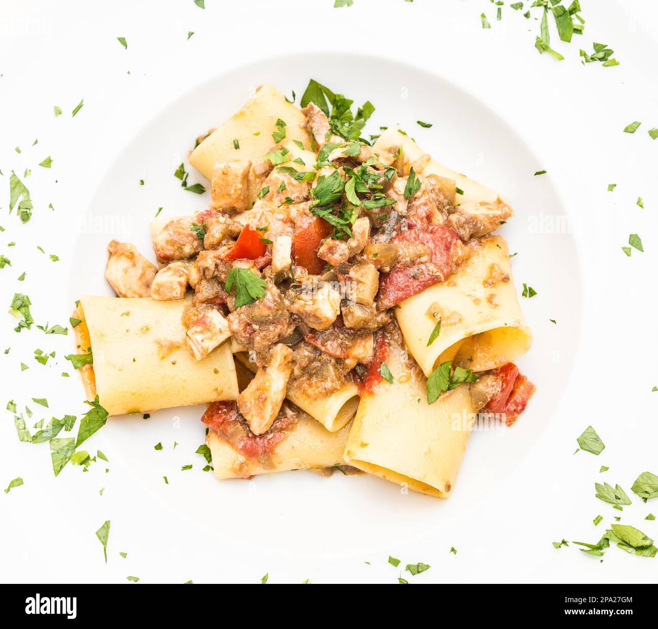 Otranto town, Puglia Region, South of Italy. Traditional Paccheri pasta with Swordfish, served with tomato, parsley, olive oil. Daylight, real Stock Photo
