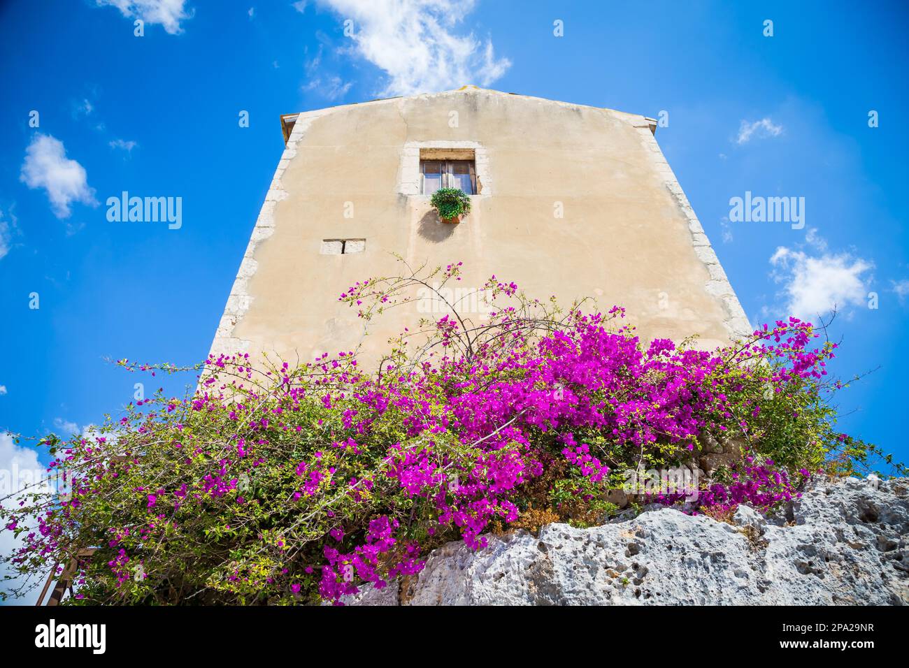 Traditional old Sicilian house during a sunny day with a wonderful blue sky background Stock Photo