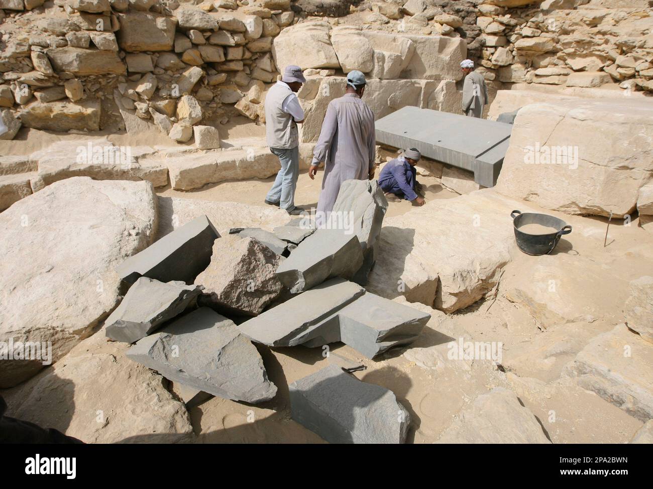 Pyramid Missing Workers are seen at the site of a so-called