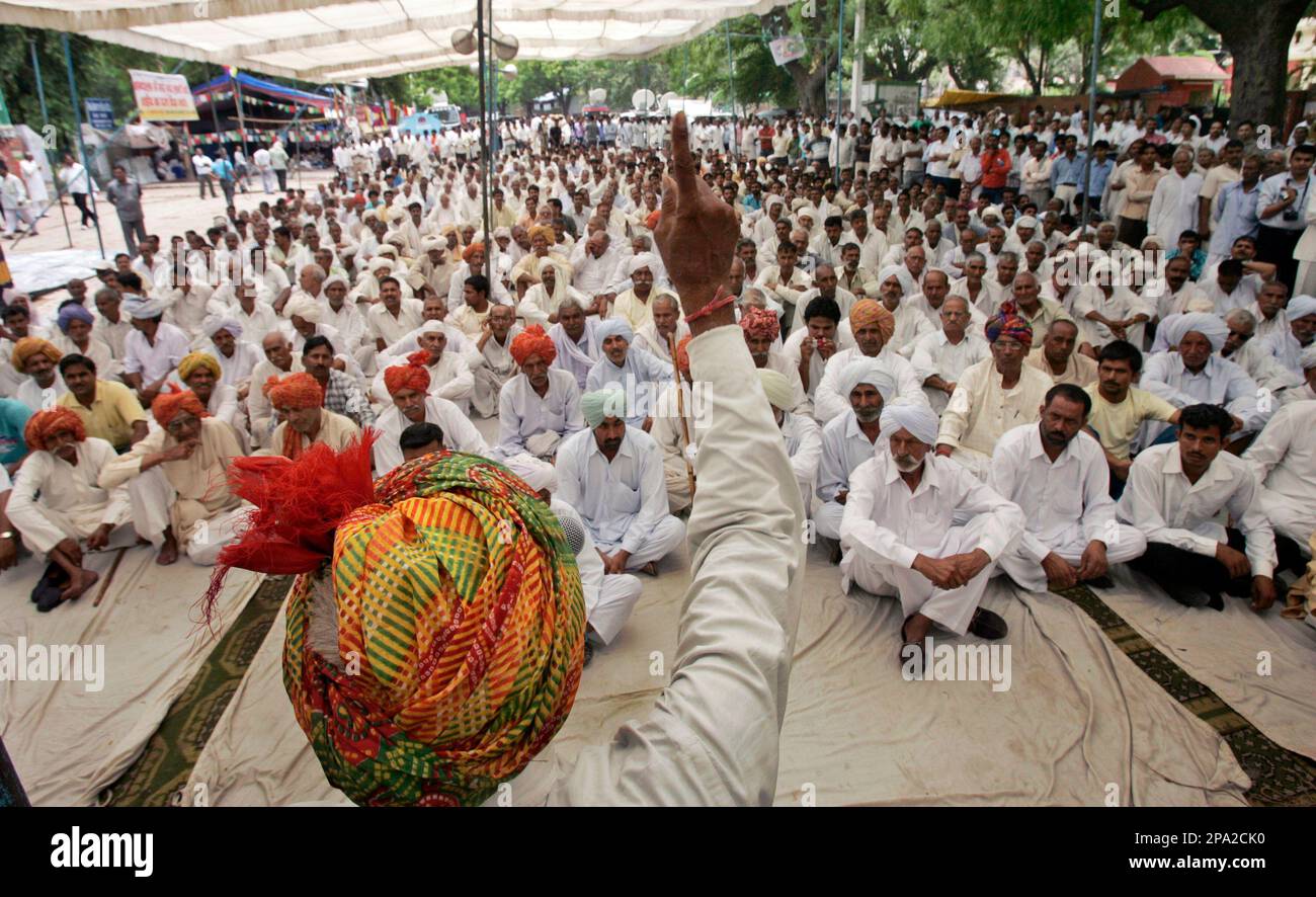 A speaker addresses members of the Gujjar community, a lower caste, at a  rally in New Delhi, India, Thursday, June 5, 2008. The Gujjar tribe began  protesting May 23 to pressure the