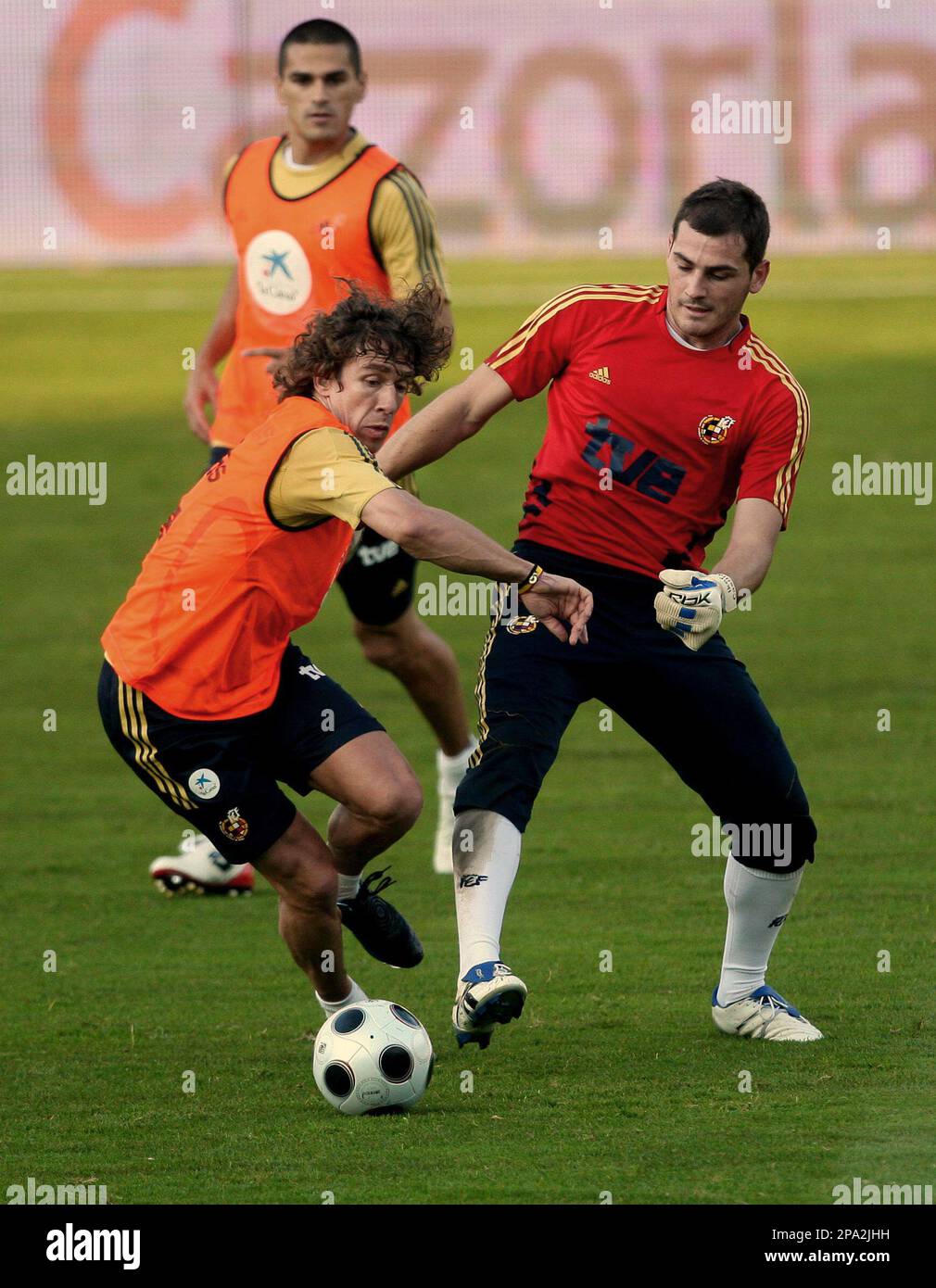 Spain's national soccer team goalie Iker Casillas, right, and defender