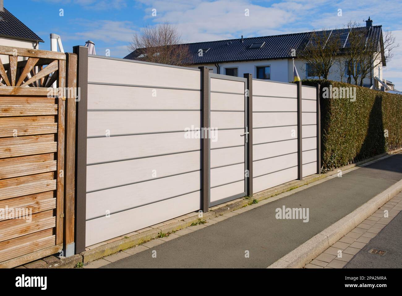 Modern fence in front of terraced house, WPC privacy fence, North Rhine