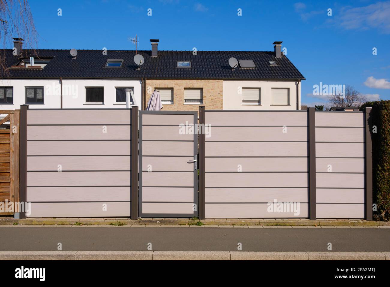 Modern fence in front of terraced house, WPC privacy fence, North RhineWestphalia, Germany