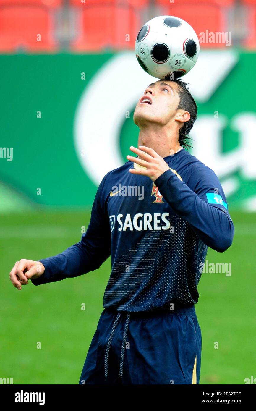 Portugal's national soccer player Cristiano Ronaldo plays with the ball  during the first training session of the Portuguese national soccer team at  the Maladiere stadium in Neuchatel, Switzerland, Monday, June 2, 2008.