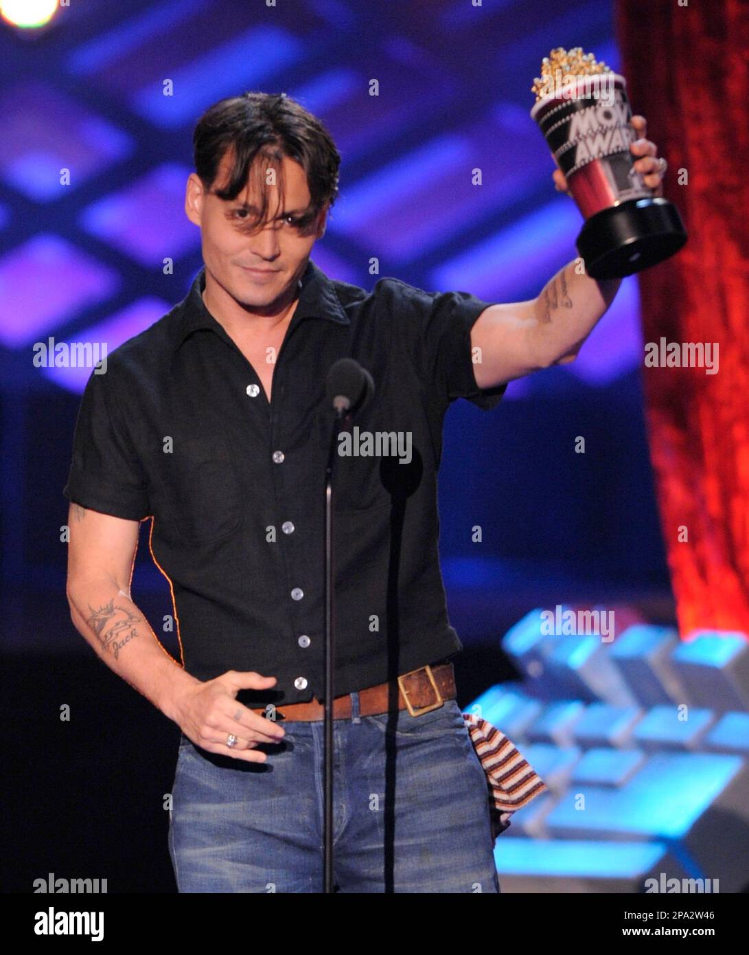 Johnny Depp accepts the award for best comedic performance for his role