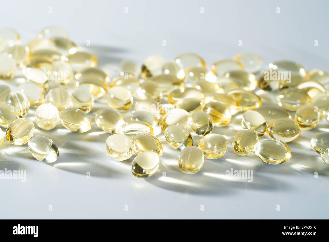 Vitamin D, omega 3, omega 6, Food supplement oil filled fish oil, vitamin A, vitamin E, flaxseed oil. Stock Photo