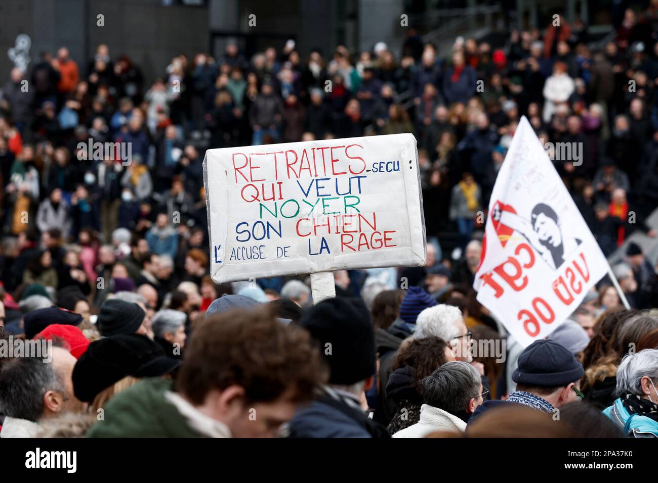 A demonstrator holds a placard during a march against the government's pension reform plan in Paris, France, March 11, 2023.  REUTERS/Benoit Tessier Stock Photo
