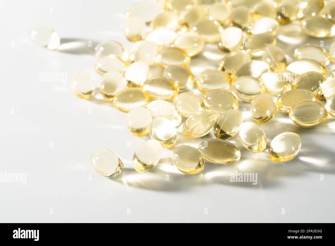 Vitamin D, omega 3, omega 6, Food supplement oil filled fish oil, vitamin A, vitamin E, flaxseed oil. Stock Photo