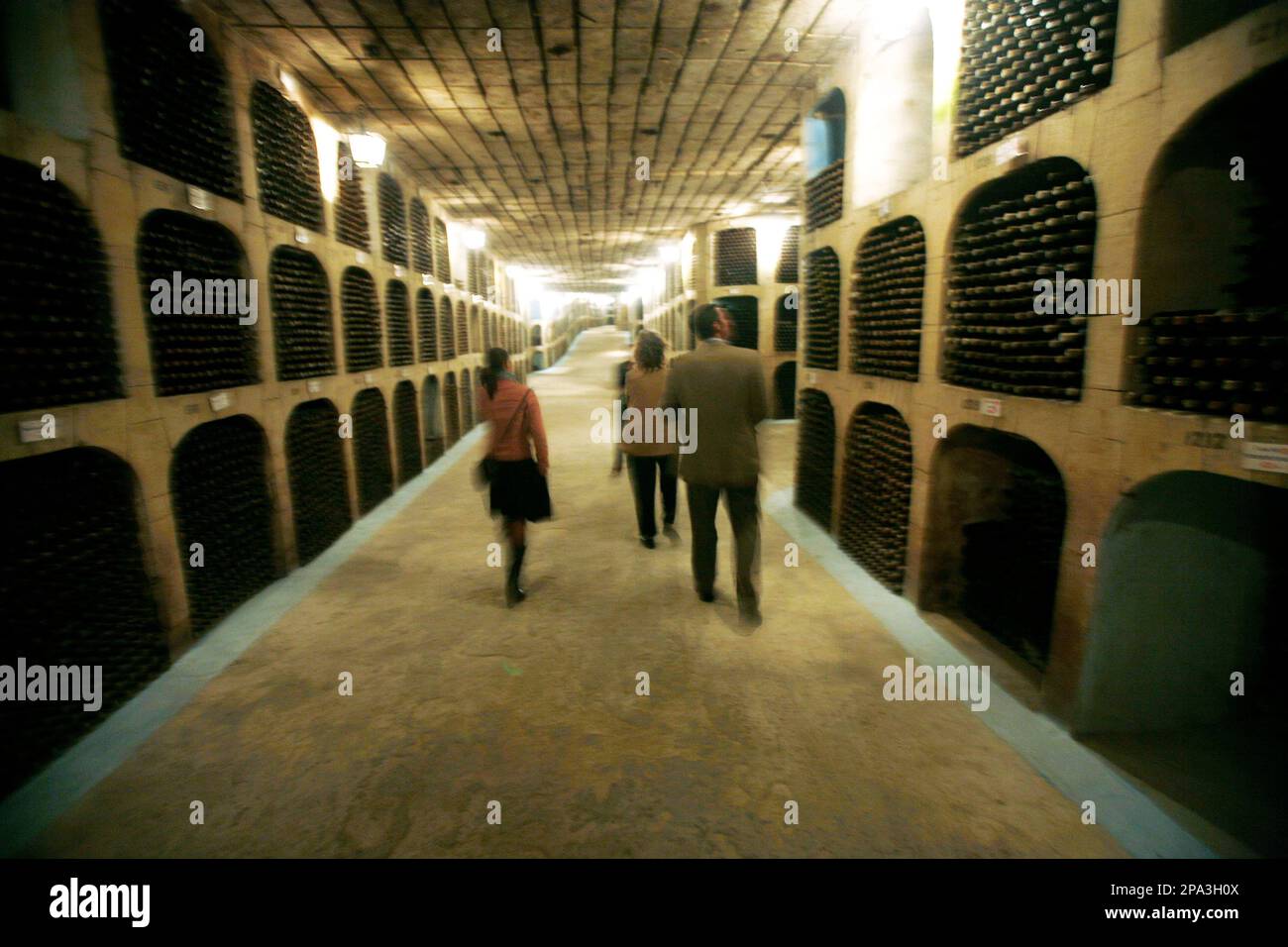 Visitors walk through the winery in Milestii Mici, Moldova Monday, May