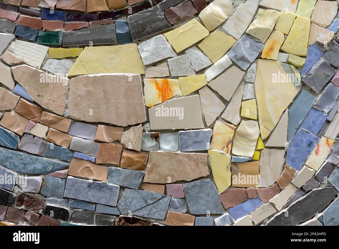 Mosaic panel from pieces of ceramic tiles, marble and granite. Abstract mosaic colored ceramic stones. Stock Photo