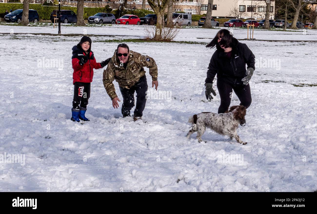Harrogate, UK. 11th Mar, 2023. As the sun was shining and the snow started to melt, Archie Flintoft, who is 7, was making the most of it with mum Vicky, dad Dean and dog Amber, having missed out on the heavier snow yesterday as he was in hospital having his 97th blood transfusion. Archie suffers from Diamond Blackfan Anemia and needs a transfusion every 3 weeks. Picture Credit: ernesto rogata/Alamy Live News Stock Photo