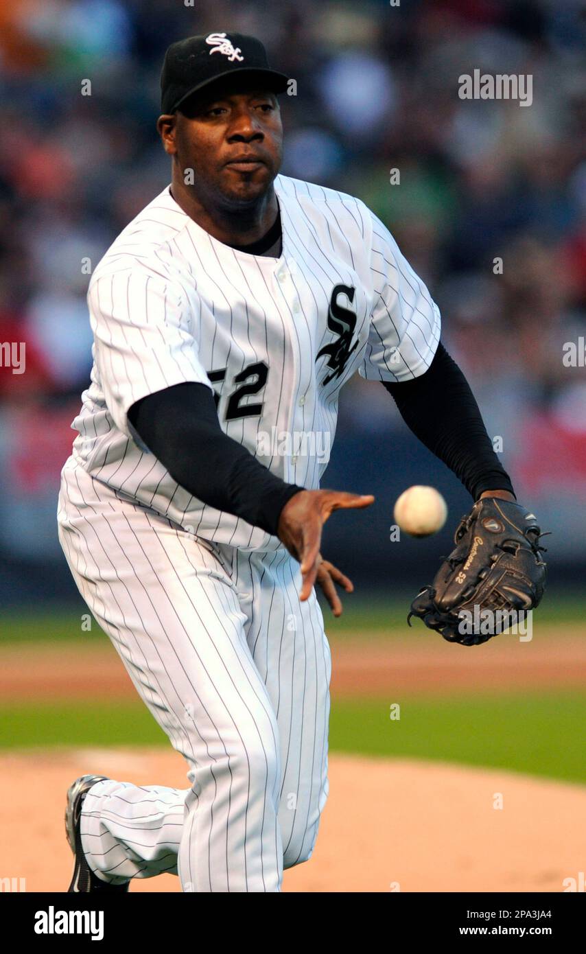 Chicago White Sox pitcher Jose Contreras tosses the ball to first base against the Los Angeles Angels during a baseball game in Chicago, Sunday, May 25