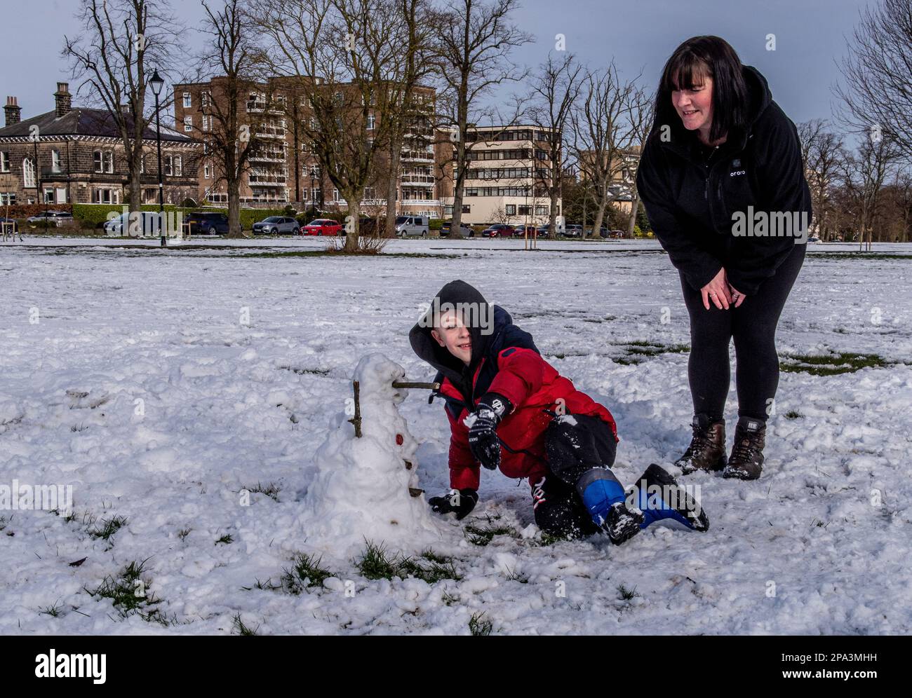 Harrogate, UK. 11th Mar, 2023. As the sun was shining and the snow started to melt, Archie Flintoft, who is 7, was making the most of it with mum Vicky, dad Dean and dog Amber, having missed out on the heavier snow yesterday as he was in hospital having his 97th blood transfusion. Archie suffers from Diamond Blackfan Anemia and needs a transfusion every 3 weeks. Picture Credit: ernesto rogata/Alamy Live News Stock Photo