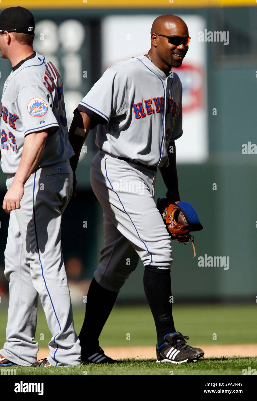 New York Mets first baseman Carlos Delgado, right, smiles after he