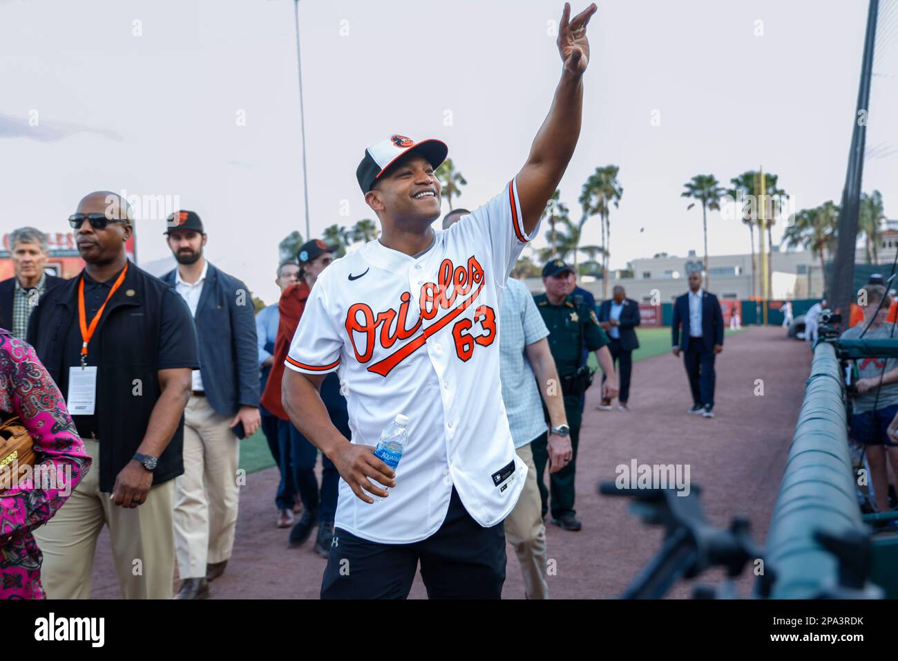 March 10, 2023, Sarasota FL USA; Maryland governor Wes Moore attended todays game and waves to the fans during an MLB spring training game between the Stock Photo