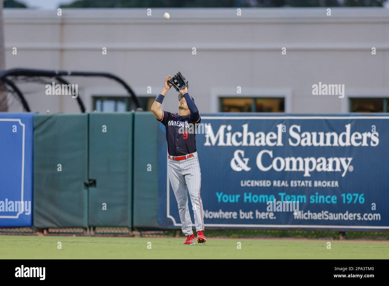 March 10, 2023, Sarasota FL USA; Minnesota Twins left fielder Trevor Larnach (9) catches a pop fly during an MLB spring training game against the Balt Stock Photo