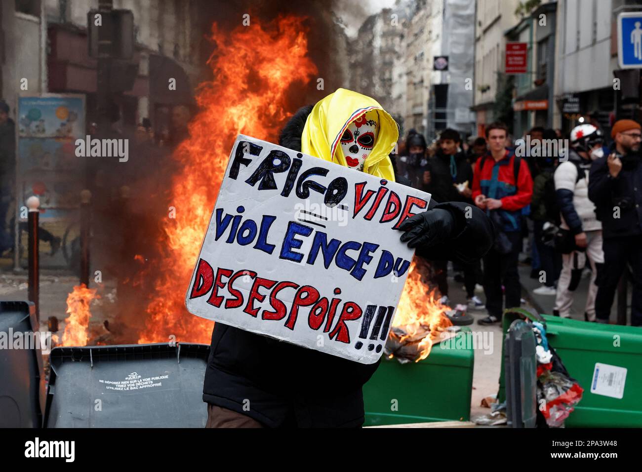 A demonstrator holds a placard during a march against the government's pension reform plan in Paris, France, March 11, 2023.  REUTERS/Benoit Tessier Stock Photo