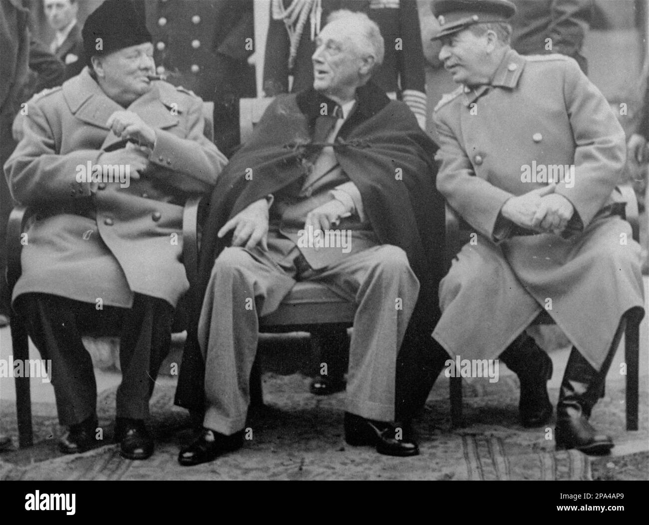 FILE ** In this Feb. 12, 1945 black-and-white file photo, Prime Minister  Winston Churchill, left, smokes a cigar while meeting with President  Franklin D. Roosevelt, center, and Russian Marshal Josef Stalin,