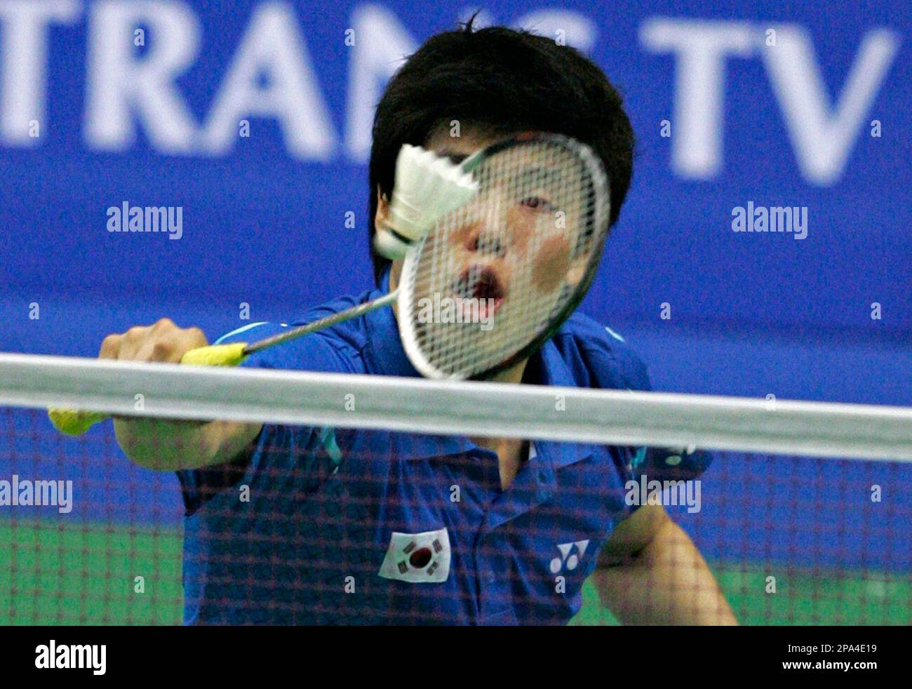 South Koreas Hwang Ji Man plays a shot during his Thomas Cup final badminton match against Chinas Xie Zhongbao and Guo Zhendong Sunday May 18, 2008 in Jakarta, Indonesia