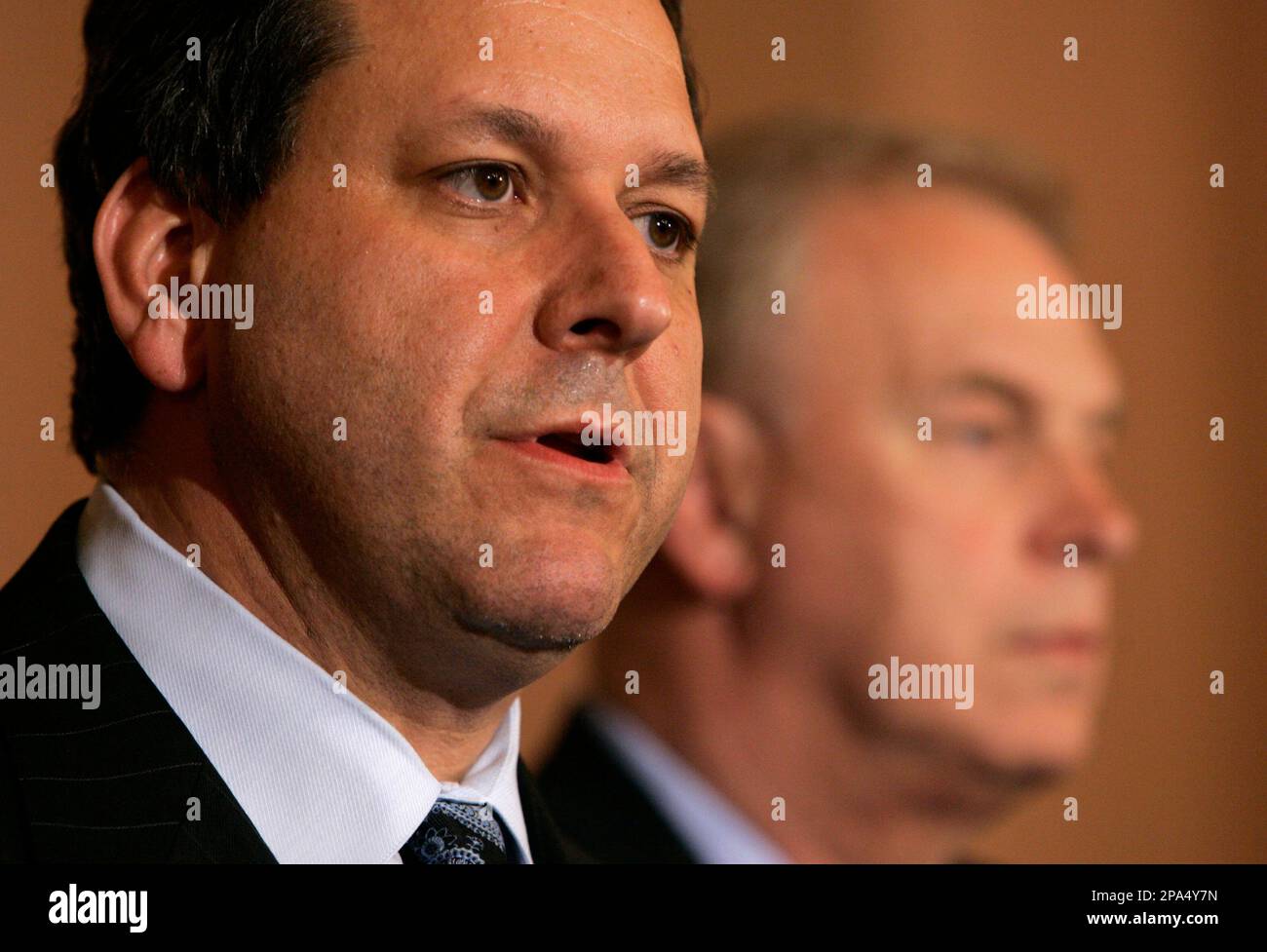 Ohio Attorney General Marc Dann, left, announces his resignation