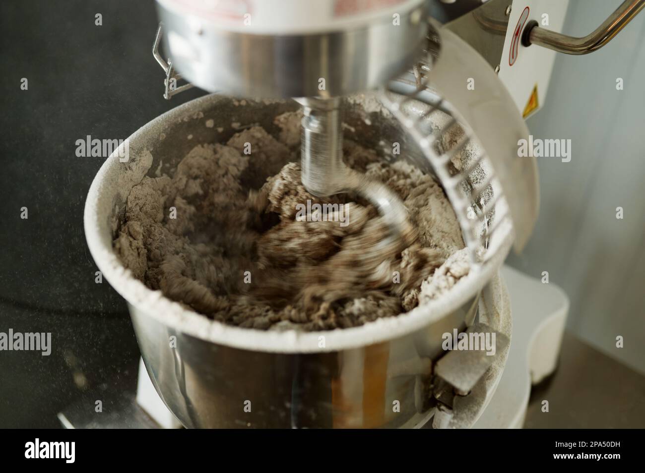 Bread Mixer In Bakery, mixing dough for baguettes in a bakery machine for  mixing dough Stock Photo - Alamy