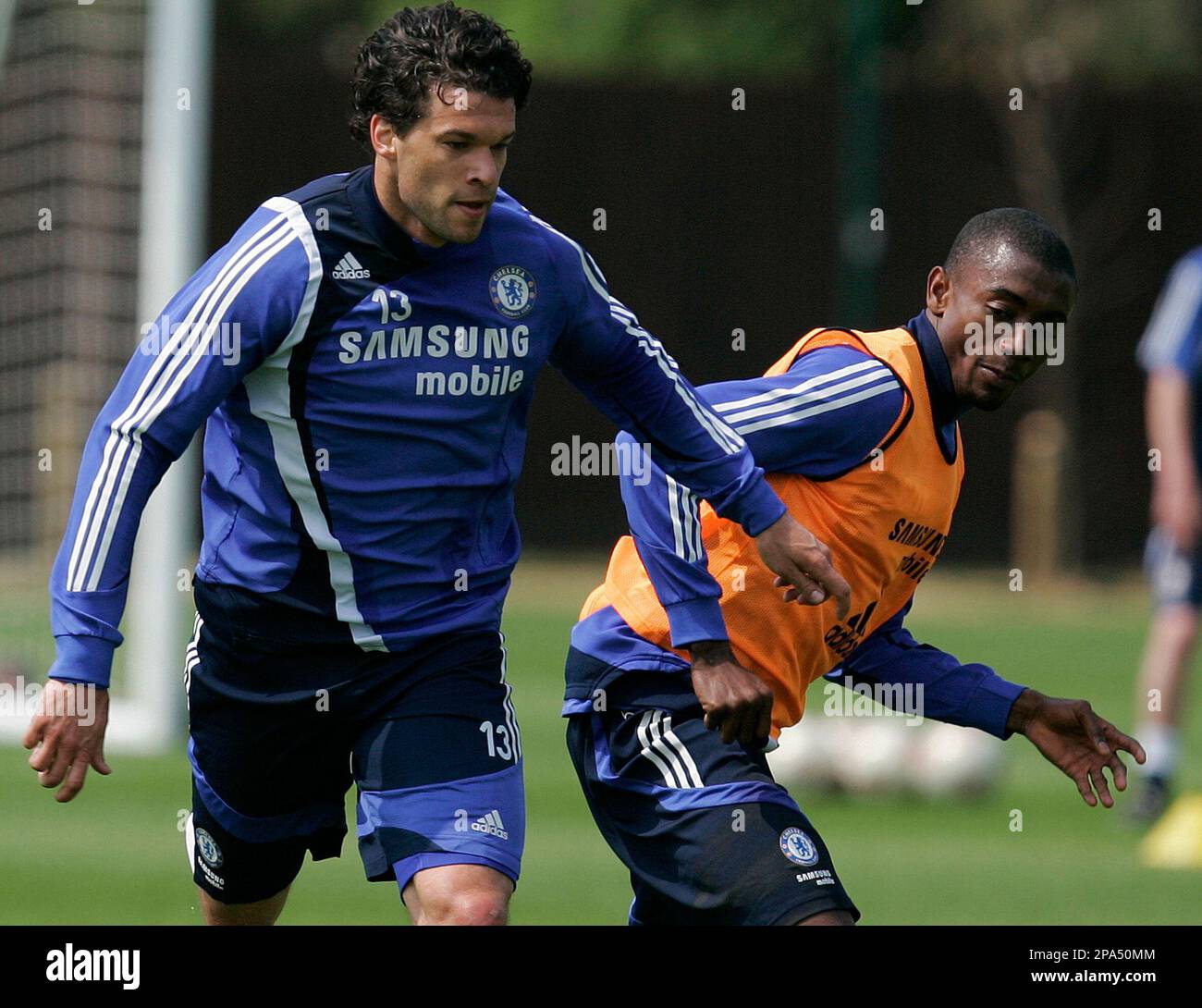 Chelsea's Michael Ballack, left and Salomon Kalou tussle for the ball as  they train at Chelsea's training facility in Cobham, England, Wednesday,  May 14, 2008. Chelsea will play Manchester United in the