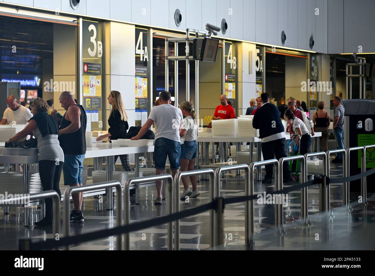 Airport passengers going through security for flights in check in area