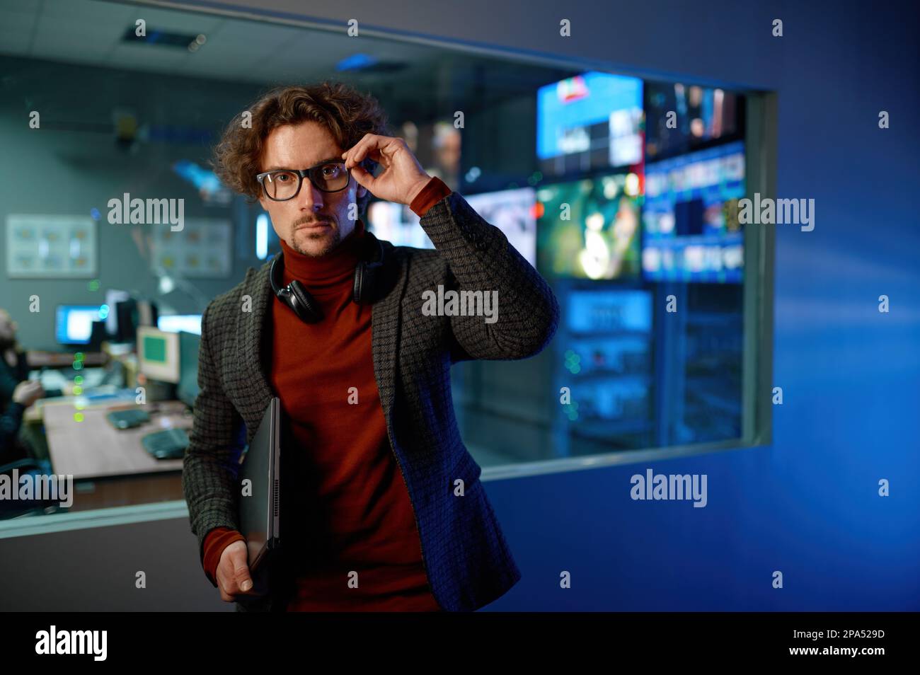 System administrator in eyeglasses in server datacenter hall Stock Photo