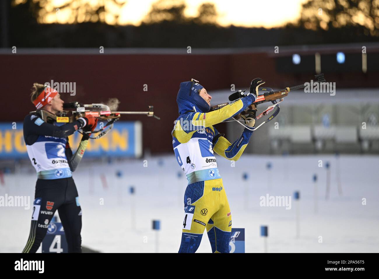 ÖSTERSUND 20230311 Sweden's Peppe Femling (right) and Germany's Benedikt Doll (#2) during the final shoot on the last leg of the men's 4x7.5 km relay Stock Photo