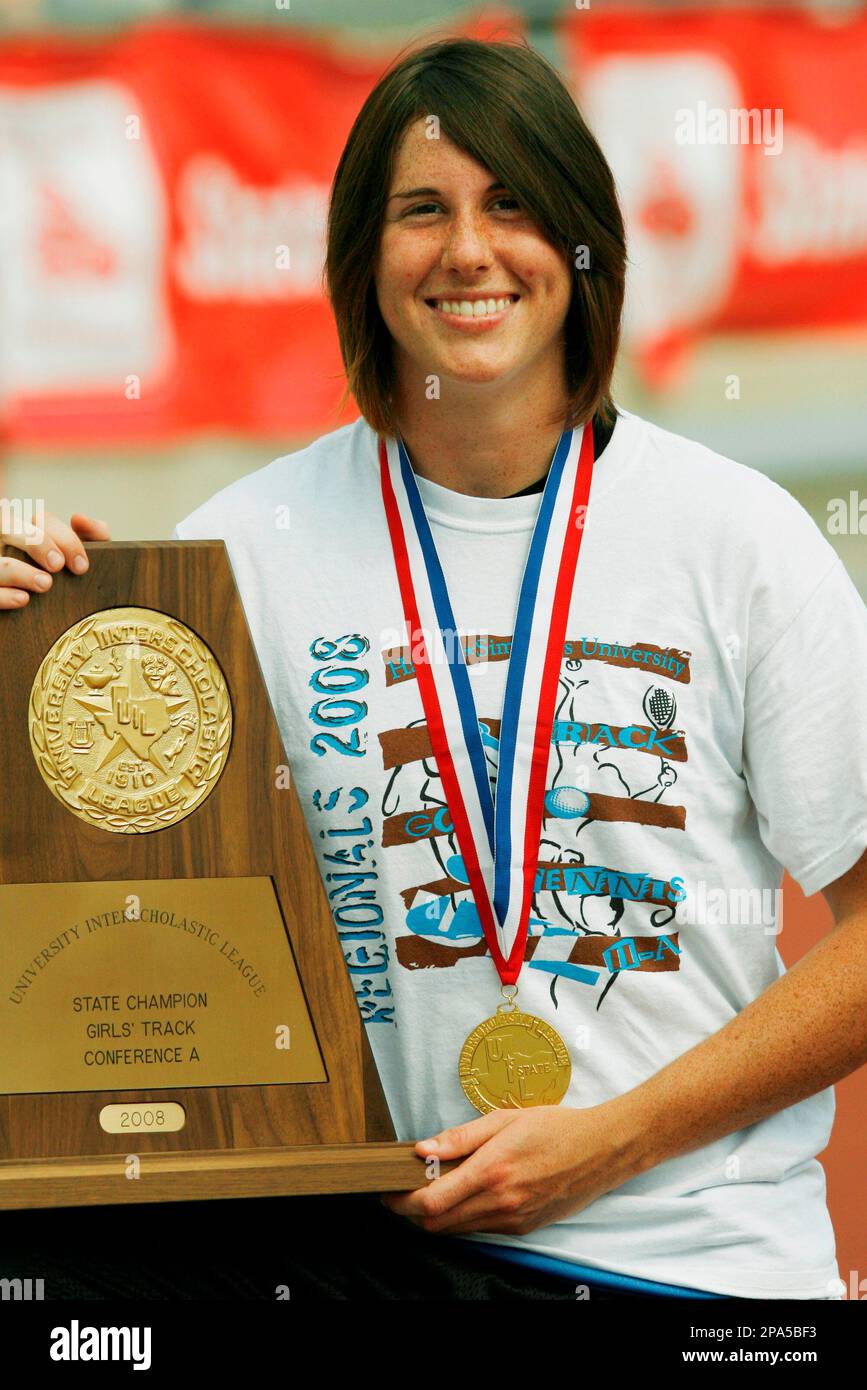 Bonnie Richardson, from Rochelle High School, holds the trophy for