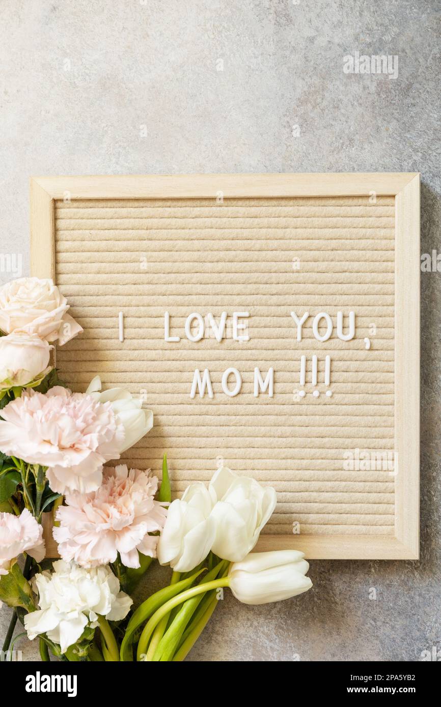 Happy Mother's Day. Letter I LOVE MOM on letterboard and beautiful ...