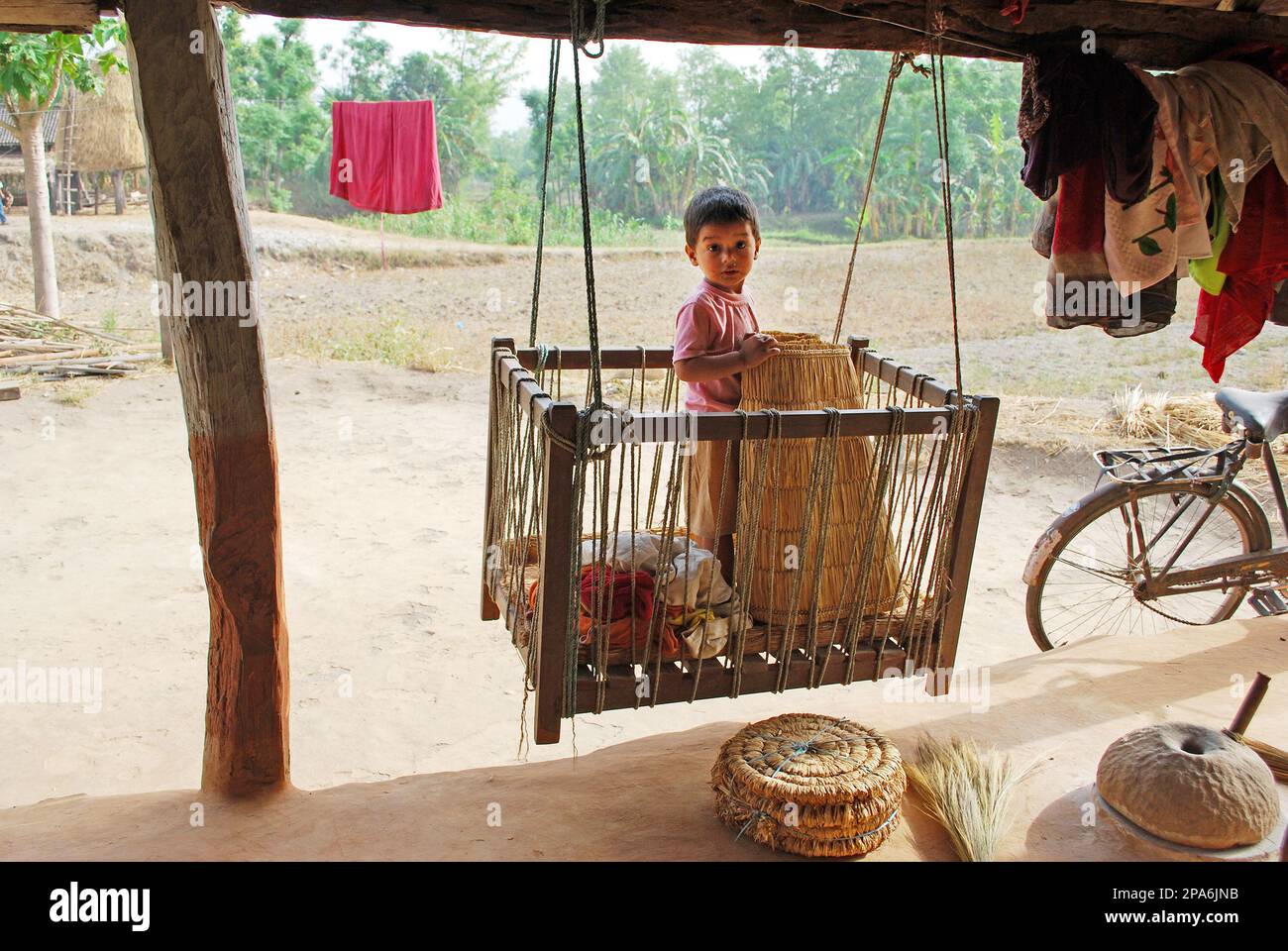 Baby in the hanging cradle, rural life Nepal Stock Photo Alamy