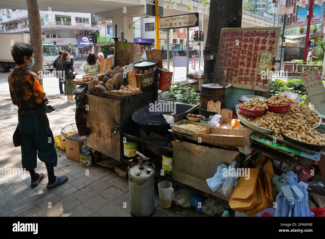 Miss Chan, a Hawker selling chestnuts and other kinds of food with a trolley near Flower Market in Mongkok.   07MAR23    SCMP / Elson Li Stock Photo