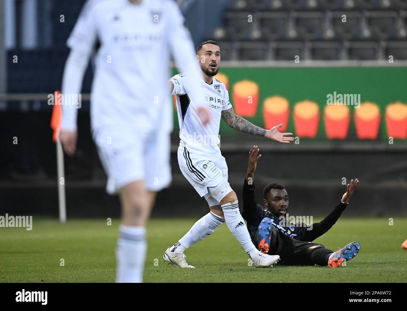 Eupen's Jason Davidson, Oostende's Thierry Ambrose, react and during a soccer match between KAS Eupen and KV Oostende, Saturday 11 March 2023 in Eupen, on day 29 of the 2022-2023 'Jupiler Pro League' first division of the Belgian championship. BELGA PHOTO JOHN THYS Stock Photo